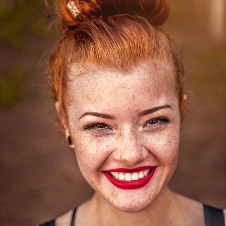 Kaveri Mehta, Lead Design Curator at Drift Stone Garden, reviewing corporate floral arrangements